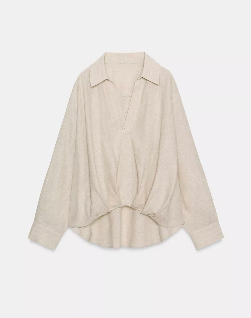 Linen blouse with pleated hemline