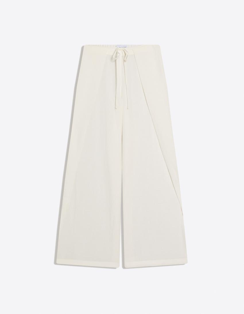 Pant with tied pleat