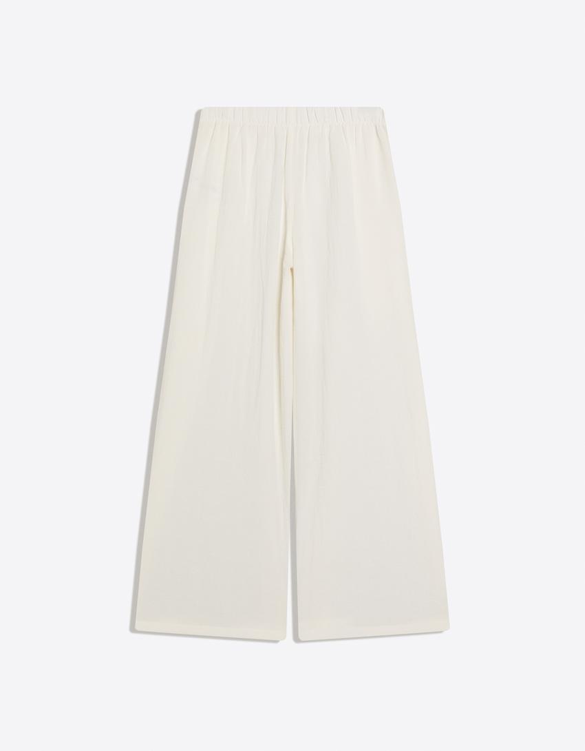 Pant with tied pleat